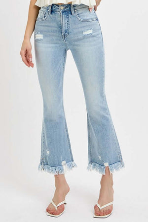 RISEN plus size cropped flare jeans with raw hem and distressed details, perfect for showcasing stylish footwear.