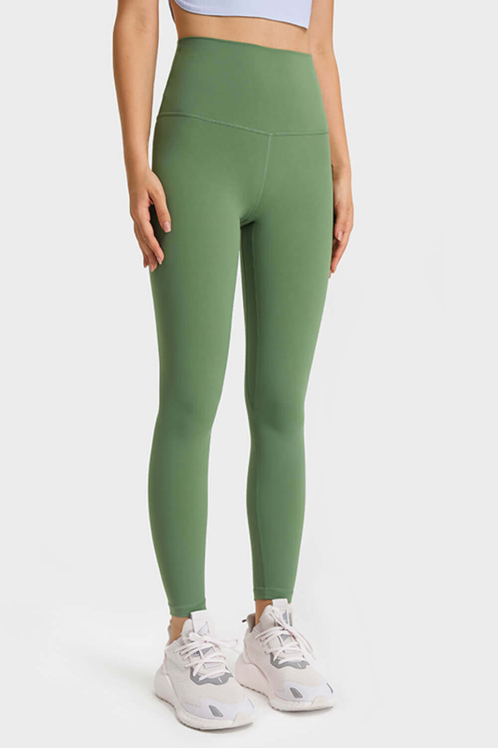 Millennia ultra-soft high waist leggings in green, perfect for yoga and athleisure style, featuring stretchy and comfortable fabric.