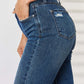 Mid Waist Distressed Slim Judy Blue Jeans featuring a flattering mid-rise and slim fit with trendy distressed detailing.