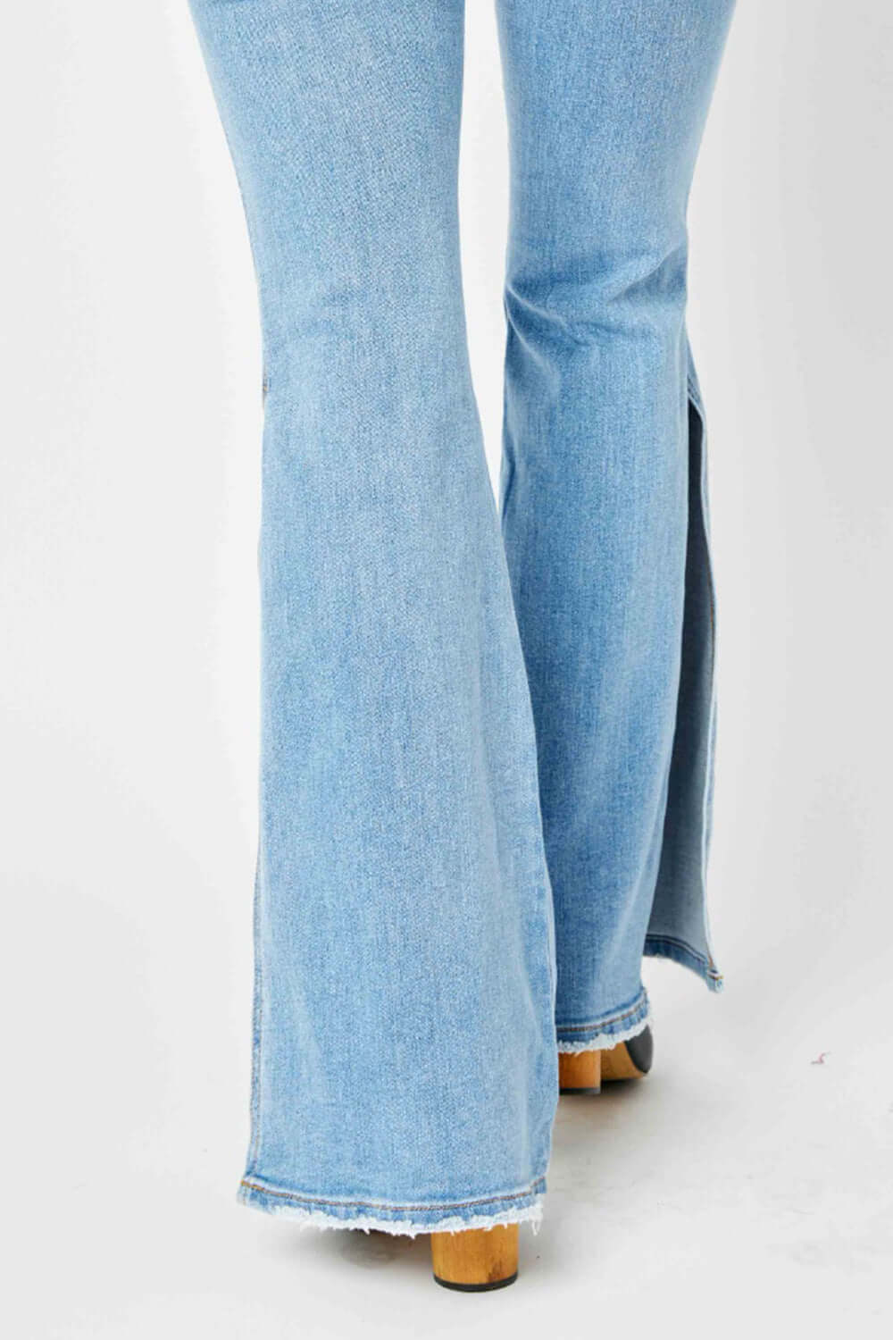 Mid Rise Raw Hem Slit Flare Jeans in light wash - Judy Blue Jeans - Full Size - Back View