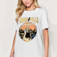 Woman wearing Graphic Round Neck Short Sleeve T-Shirt with Nashville design and guitar print in white, casual style.