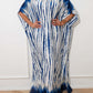 Woman wearing a blue and white slit tie-dye half sleeve cover up with a slightly stretchy and opaque fabric made of 100% cotton.