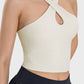 Stylish Millennia Crisscross Grecian Neck Active Cami in light color, perfect for gym workouts and staying cool.