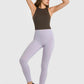 Model showcasing Millennia High Waist Ankle-Length Yoga Leggings in lavender, perfect for stylish workouts and yoga sessions.