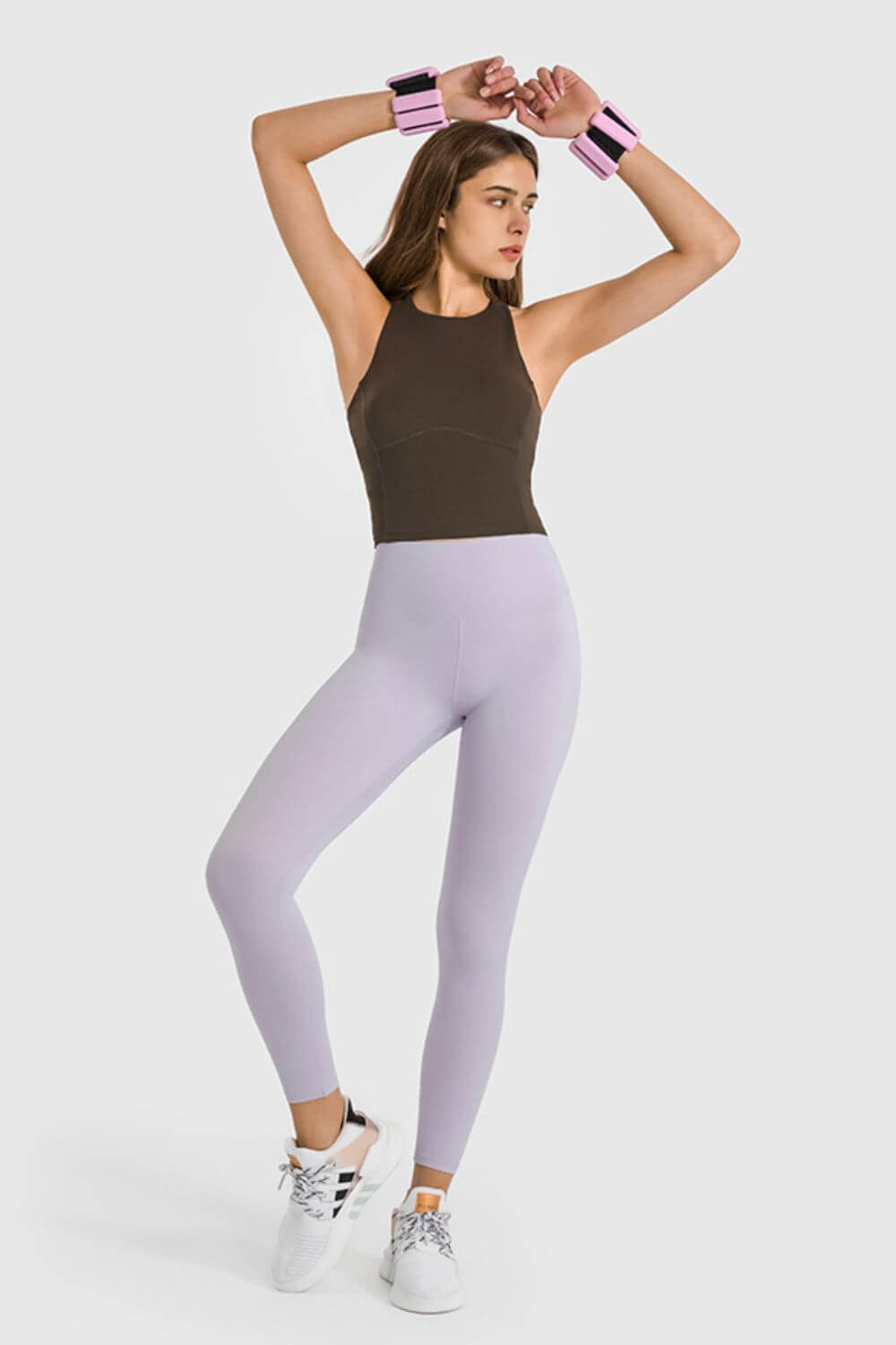 Model showcasing Millennia High Waist Ankle-Length Yoga Leggings in lavender, perfect for stylish workouts and yoga sessions.