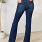 Back view of woman wearing slim bootcut jeans, showing off the flattering fit and flared legs, perfect for any occasion.