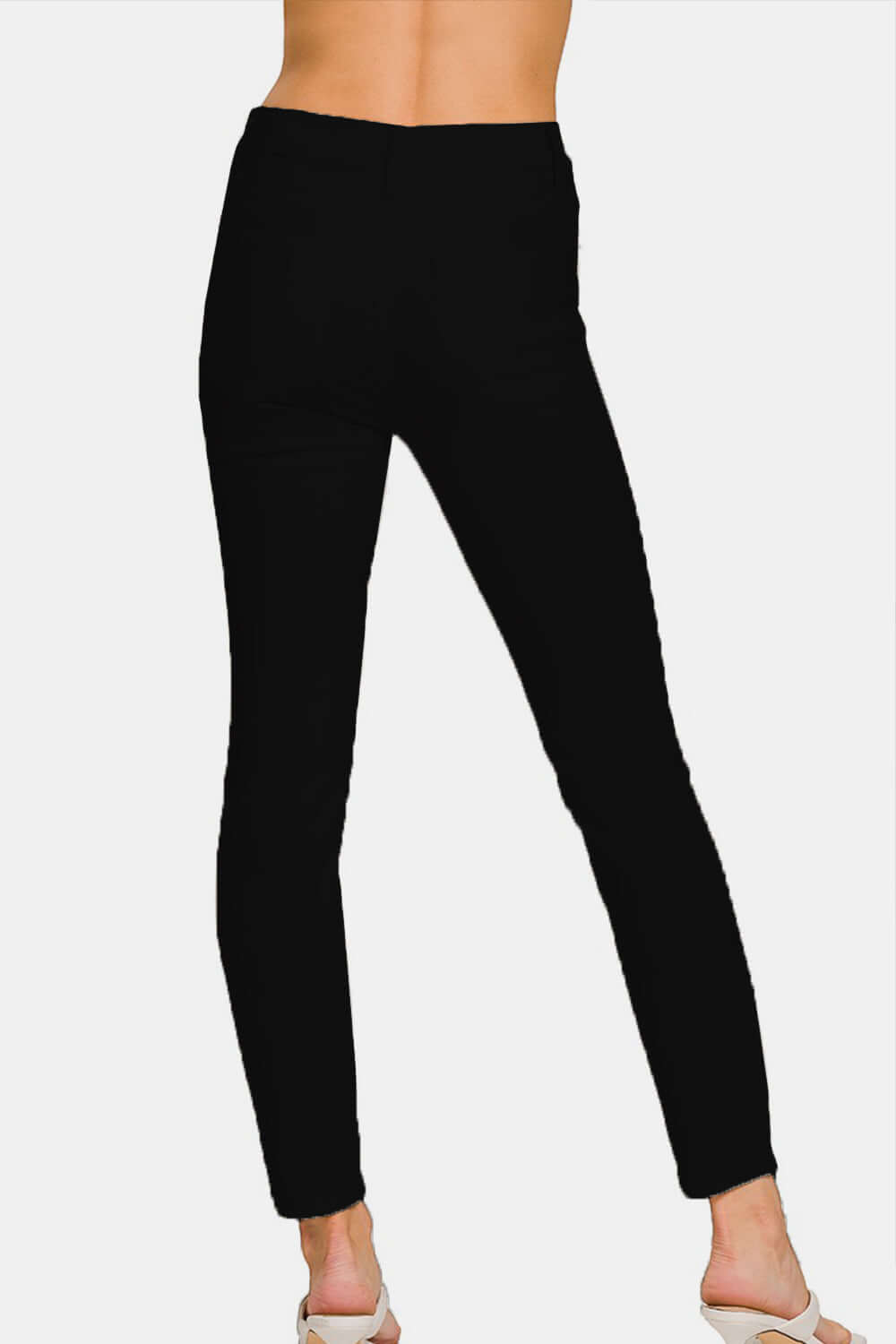 High-Rise Skinny Jeans, showcasing a flattering high-waist and sleek skinny leg silhouette, perfect for any fashion-forward wardrobe.