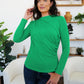 Woman modeling green FAM-FAM Ruched Mock Neck Long Sleeve T-Shirt, ideal for fall fashion layering.