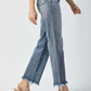 Woman wearing High Waist Raw Hem Straight Jeans by Risen Jeans with chic high-rise waist and casual raw hem detailing.