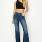 Woman modeling High Rise Side Shadow Seam Detail Slit Flare Risen Jeans, showcasing stylish high rise fit, flared legs, and trendy slit details.