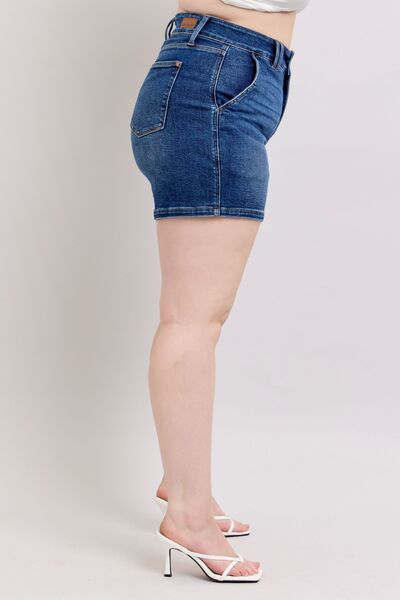 Side view of Judy Blue plus size double button denim shorts showcasing high-waisted fit and stylish design.