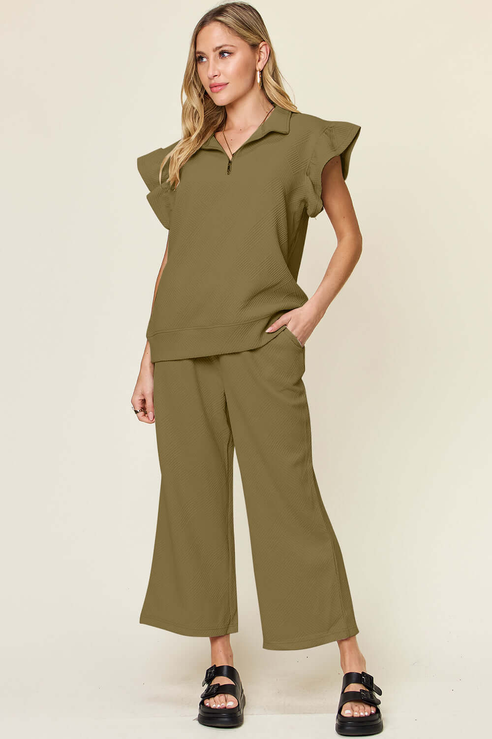 Woman wearing olive Texture Ruffle Short Sleeve Top and Drawstring Wide Leg Pants Set with pockets.