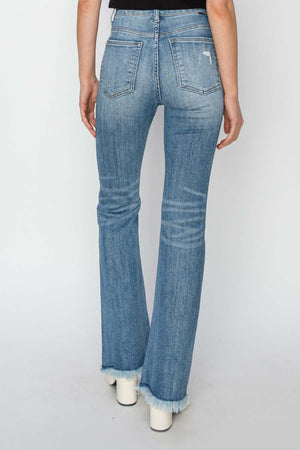 Back view of high rise frayed hem bootcut jeans by Risen Jeans on model, showcasing trendy, flattering fit and stylish detail.