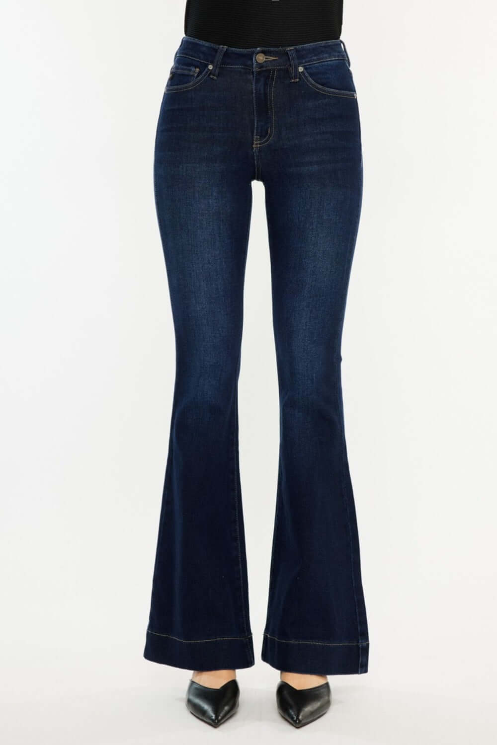 Kancan high-rise slim flare jeans in deep stone wash for a chic and polished look, styled with heels and a fitted top.