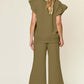 Woman modeling a Texture Ruffle Short Sleeve Top and Drawstring Wide Leg Pants Set from the back view.