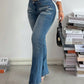 Stylish woman in Bella Road mid rise bootcut jeans, showcasing trendy fit and functional pockets for a chic look.