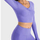 Millennia Ruched Cropped Long Sleeve Sports Top in lavender, featuring a stylish ruched design for trendy athletic wear.