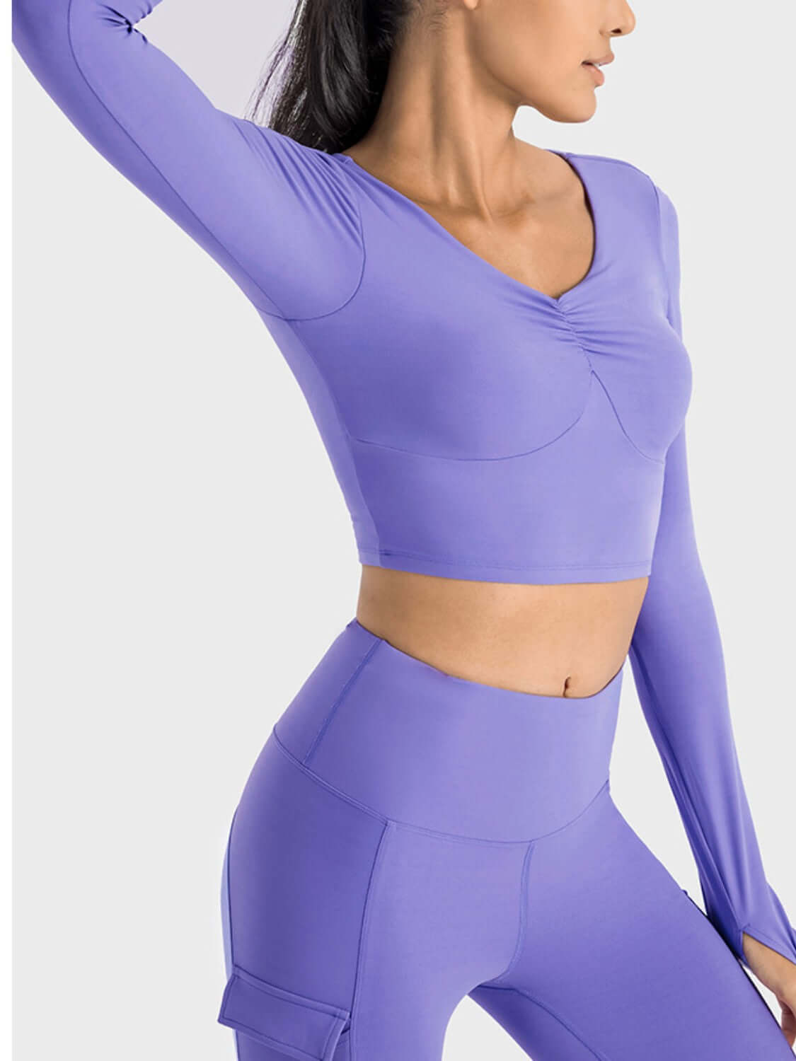 Millennia Ruched Cropped Long Sleeve Sports Top in lavender, featuring a stylish ruched design for trendy athletic wear.