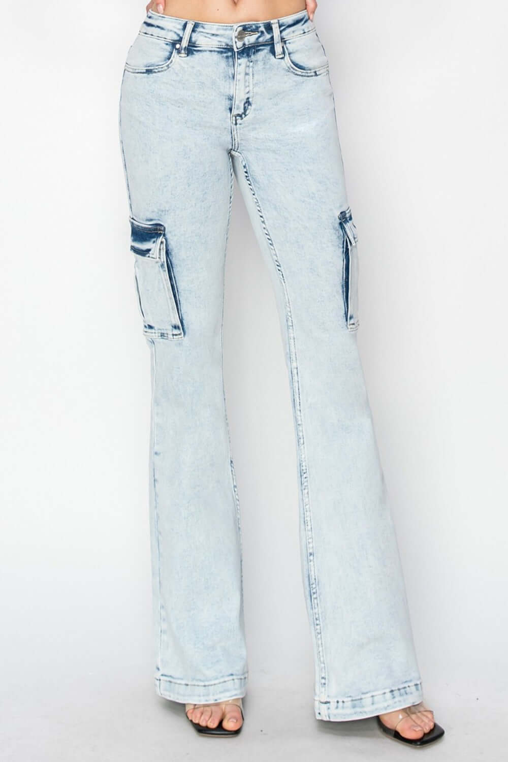 RISEN high rise cargo flare jeans with utility pockets and retro vibe, perfect for casual or dressy outfits, light wash style.