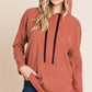 Woman models BOMBOM Contrast Drawstring Drop Shoulder Knit Hoodie, showcasing its cozy relaxed fit and stylish design.