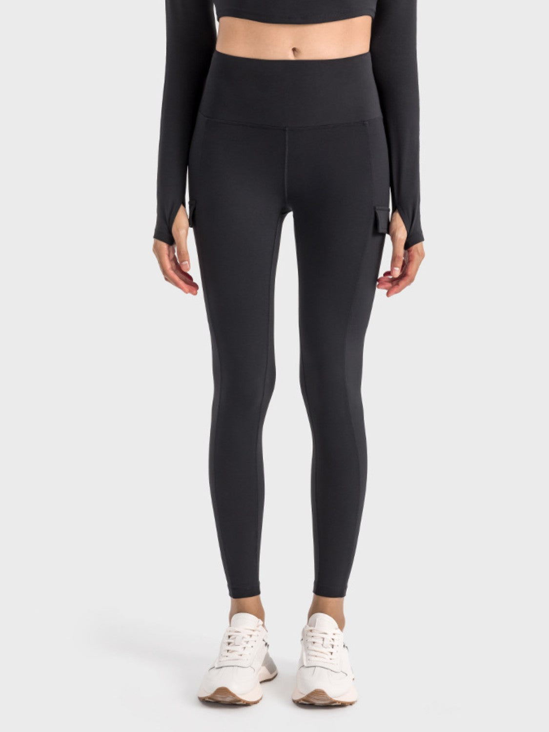 Millennia wide waistband sports leggings in black, featuring a pocketed design and moderate stretch for comfort.