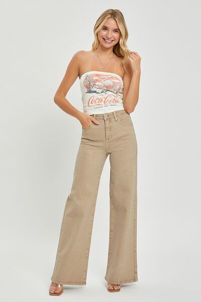 Woman wearing RISEN full size tummy control high rise wide leg jeans, styled effortlessly for a trendy look.