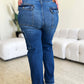 Woman wearing High Waist Straight Cargo Judy Blue Jeans showing back pockets and straight leg fit, standing on wooden floor