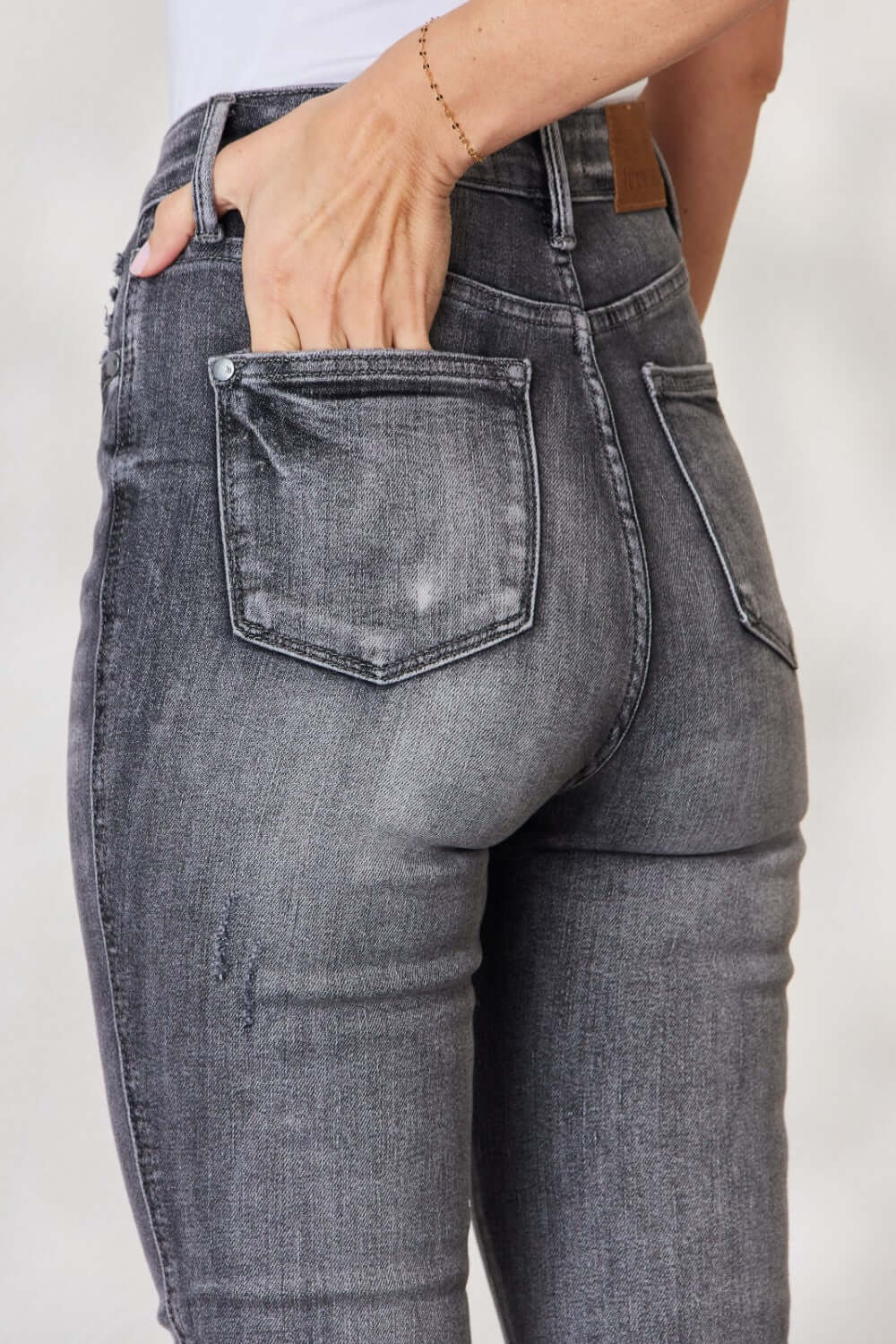 High Waist Tummy Control Release Hem Skinny Jeans back view showing flattering fit and stylish details. Keywords: Judy Blue Jeans.