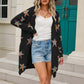 Woman wearing Angel Wings Star Open Front Cardigan, rocking playful star design, perfect for cozy style with a quirky twist.