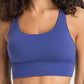 Model wearing a stylish Millennia crisscross scoop neck active tank in vibrant blue, perfect for workouts and active lifestyles.