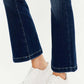 Stylish Kancan mid-rise button fly flare jeans in medium wash paired with white sneakers.