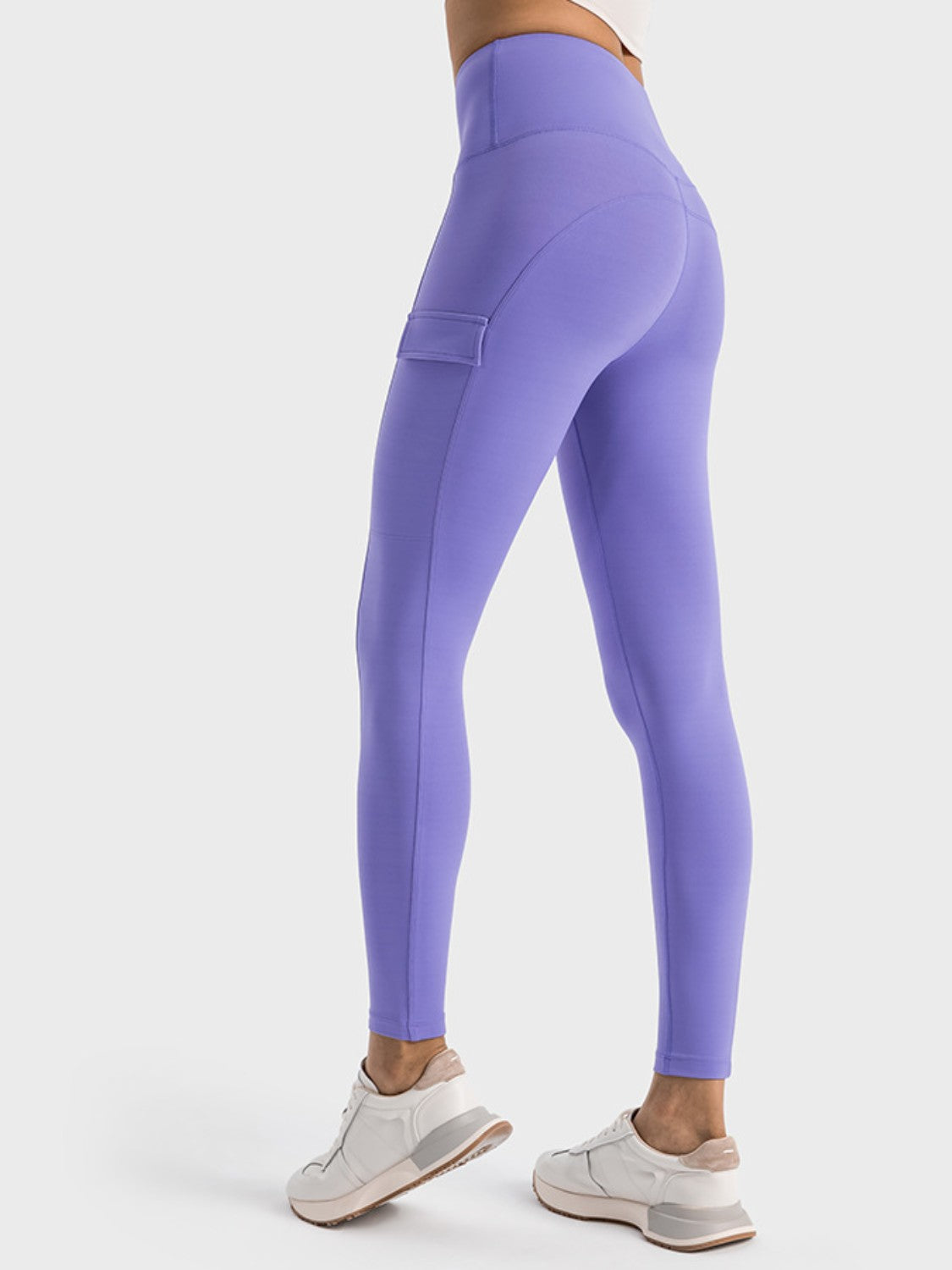 Women's lavender sports leggings with wide waistband and side pocket, perfect for workouts and casual wear.