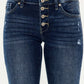 Mid-rise Kancan flare jeans with button fly, medium wash, stretchy denim, showcasing trendy style and comfort.