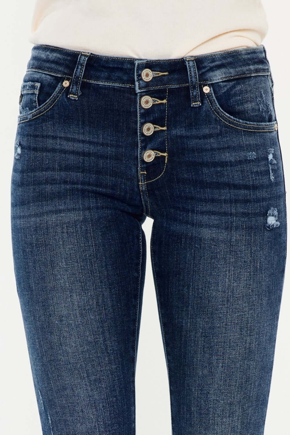 Mid-rise Kancan flare jeans with button fly, medium wash, stretchy denim, showcasing trendy style and comfort.