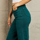 Hailey full-size Judy Blue jeans, high waisted with tummy control in a rich teal hue, displayed on a person wearing a white top.