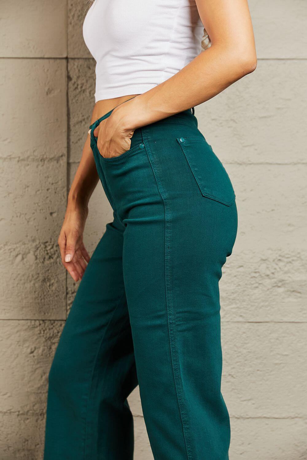 Hailey full-size Judy Blue jeans, high waisted with tummy control in a rich teal hue, displayed on a person wearing a white top.