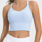 Light blue crisscross active tank top with a round neck, perfect for workouts and casual wear.