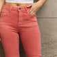 High-rise Bailey flare jeans with side slits show off stylish shoes and curves, made from stretchy premium denim by Risen Jeans.