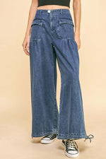 Davi & Dani drawstring hem wide leg mid rise jeans in blue, showcasing a stylish and comfortable design with pockets.