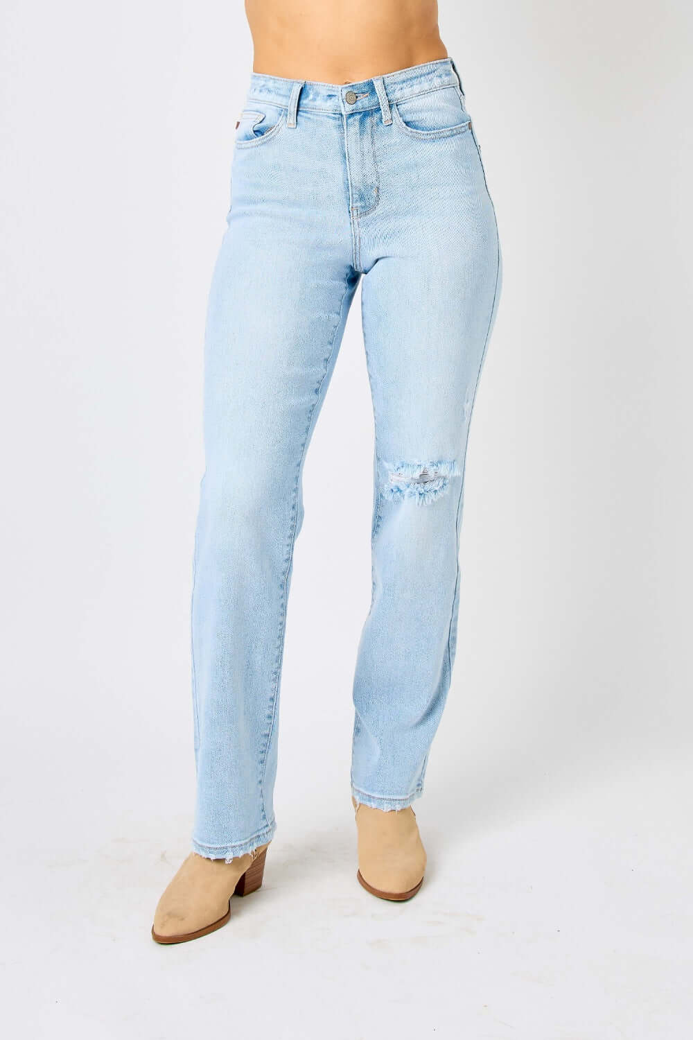 High waist distressed straight jeans in light blue denim by Judy Blue Jeans, accentuating curves with a stylish and edgy look.