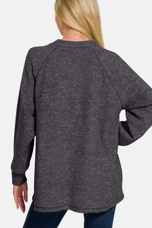 Zenana brushed hacci sweater back view, showcasing high-low hem and cozy melange knit in a stylish dark gray color.