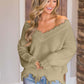 Woman wearing Bella Road Frayed Hem Dropped Shoulder Sweater, showcasing a playful and stylish look.