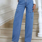 Woman wearing Bella Road High Waist Straight Leg Jeans with Pockets standing on stairs