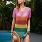 Model wearing Bella Road Swim Openwork Round Neck Cover-Up in rainbow stripes, standing by a pool, ready for summer fun.