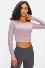 Millennia long sleeve cropped top in soft mauve with sports strap and cutout detail, perfect for active moms.