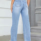 Woman wearing Bella Road Distressed Jeans with pockets, showcasing a stylish and playful design, perfect for an edgy look.