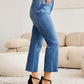 Woman wearing RFM Jeans Mini Mia Full Size Tummy Control High Waist Jeans, showcasing side view in a casual setting with heels