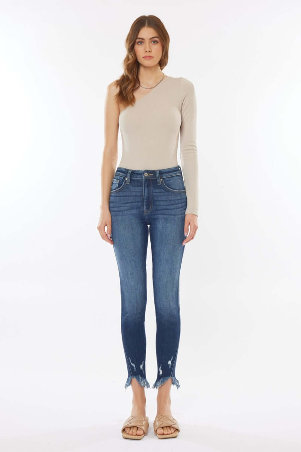 Model wearing Raw Hem High Waist Cropped Jeans with a trendy cut-off hem and flattering high waist, paired with a stylish beige top.