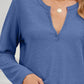 Woman wearing Bella Road blue waffle-knit notched long sleeve t-shirt with slight stretch and gold necklace.