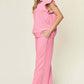 Woman wearing pink texture ruffle short sleeve top and drawstring wide leg pants set, featuring pockets, made of polyester and spandex.